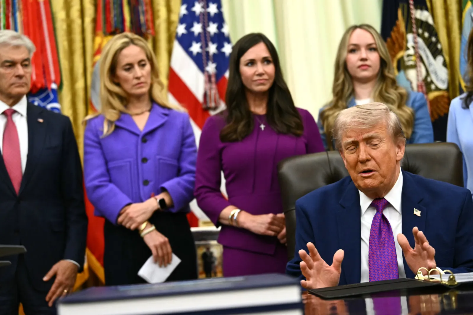 President Donald Trump, flanked by Medicare and Medicaid Administrator Mehmet Oz (L), speaks at the White House on May 11, 2026.