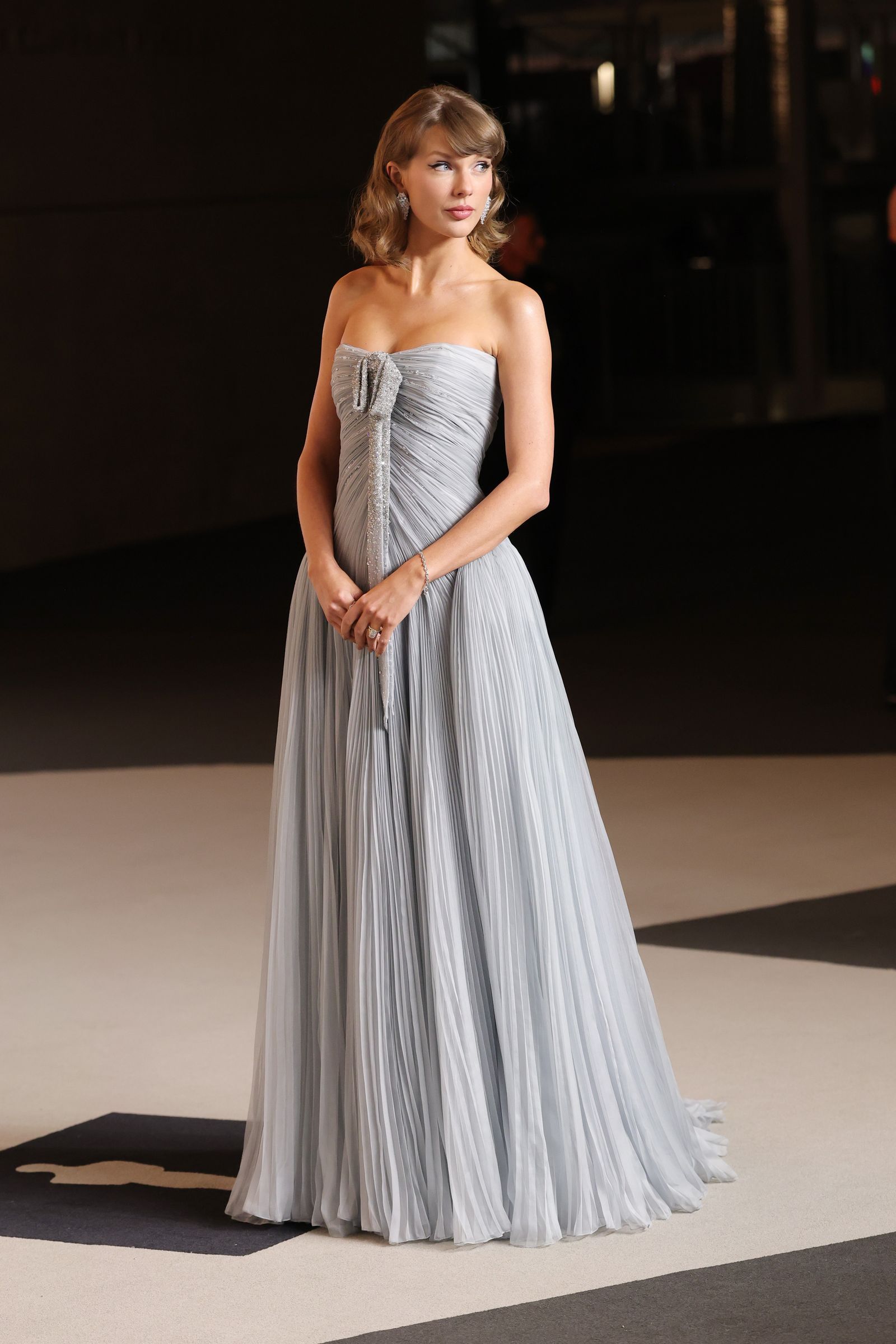 Image may contain Taylor Swift Clothing Dress Formal Wear Fashion Gown Wedding Wedding Gown Evening Dress and Adult