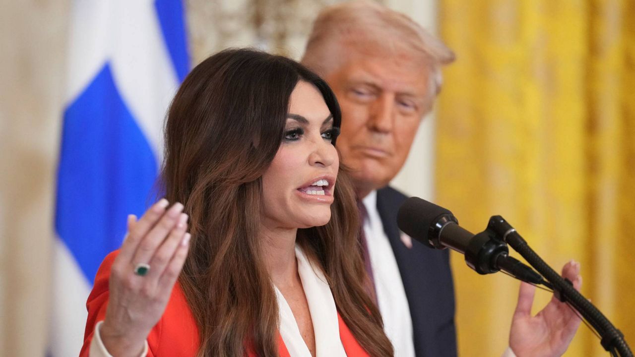 Kimberly Guilfoyle speaks as President Donald Trump listens at a reception celebrating Greek Independence Day in the East Room of the White House, March 24, 2025, in Washington. (AP Photo/Jacquelyn Martin, File)