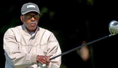 George O. Jones, 94, finishes his swing during a drive at the William J. Devine Golf Course at Franklin Park.