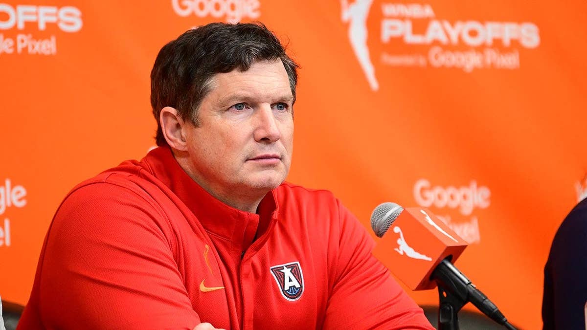 Karl Smesko speaks to reporters after a WNBA game