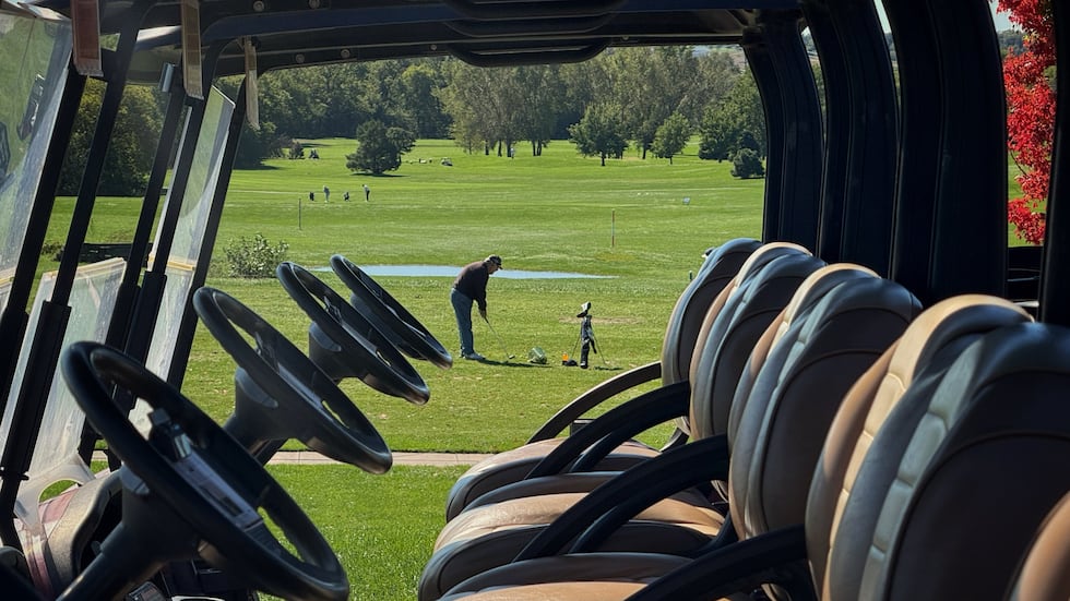 Players tee off on the driving range at Crooked Creek Golf Club in Lincoln on Friday, Oct. 2,...