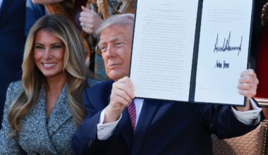 President Trump holds the executive order he and first lady Melania Trump signed in the Rose Garden of the White House on October 19, 2026 in Washington, D.C.