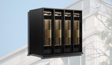 A server rack displayed outdoors against a building structure, featuring multiple units with golden heat sinks.