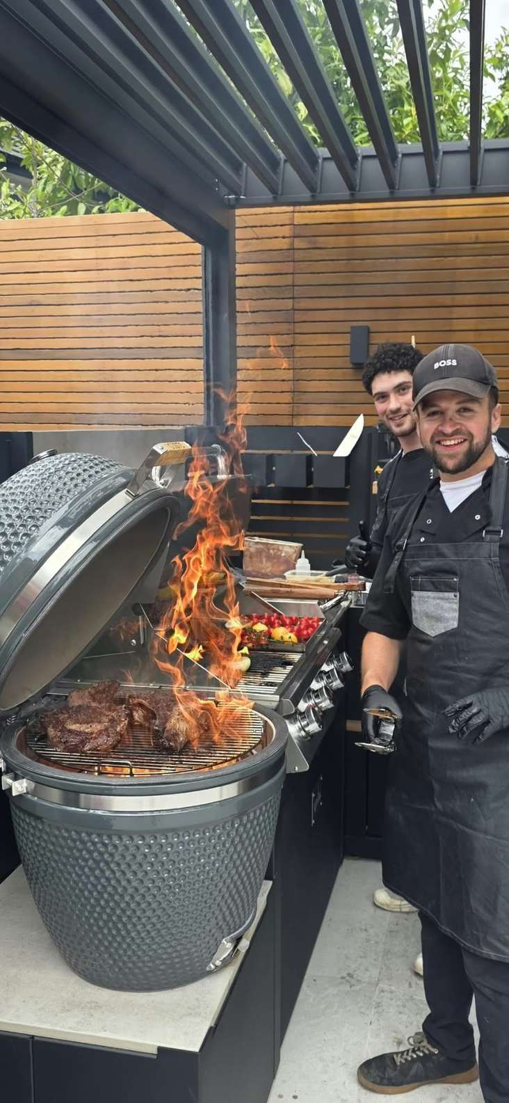 Levi Dansky (right) cooking at one of his popular barbecues (Photo: courtesy)