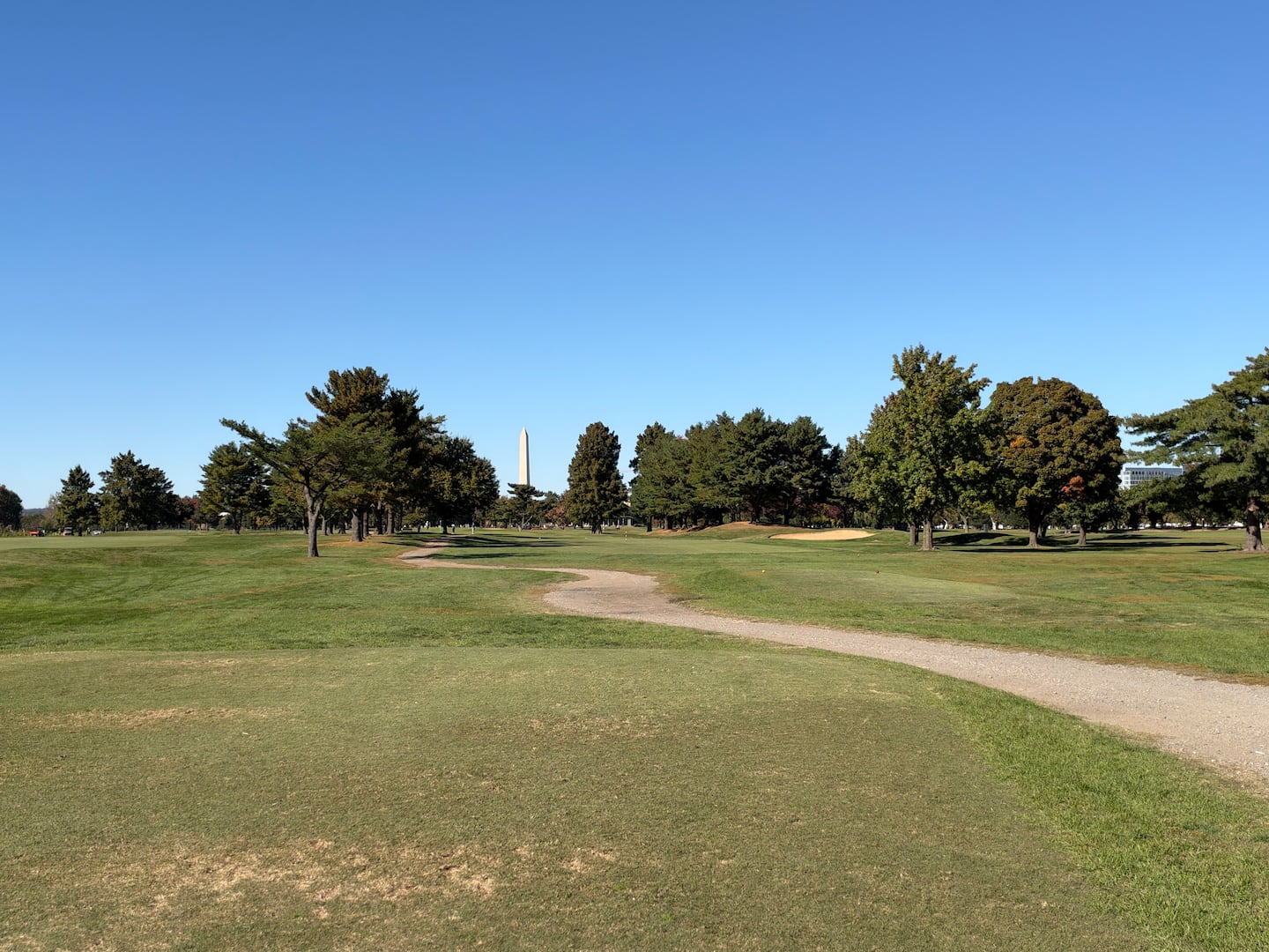 The tee box on the seventh hole at East Potomac Golf Links, with the Washington Monument in the distance.