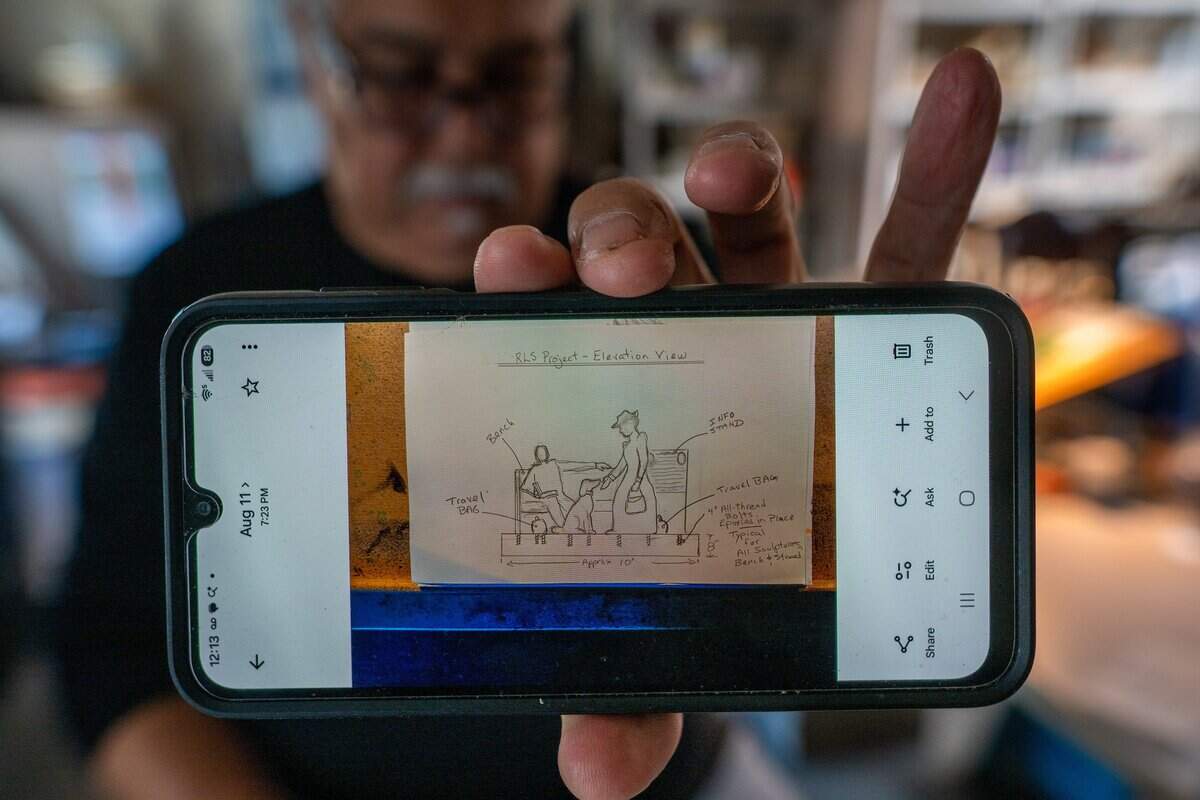 Sculptor Garr Ugalde shows an early sketch for a sculpture of Robert Louis Stevenson, Fanny Osbourne Stevenson, and their dog, Chuchu, as he stands his Sacramento studio last month.