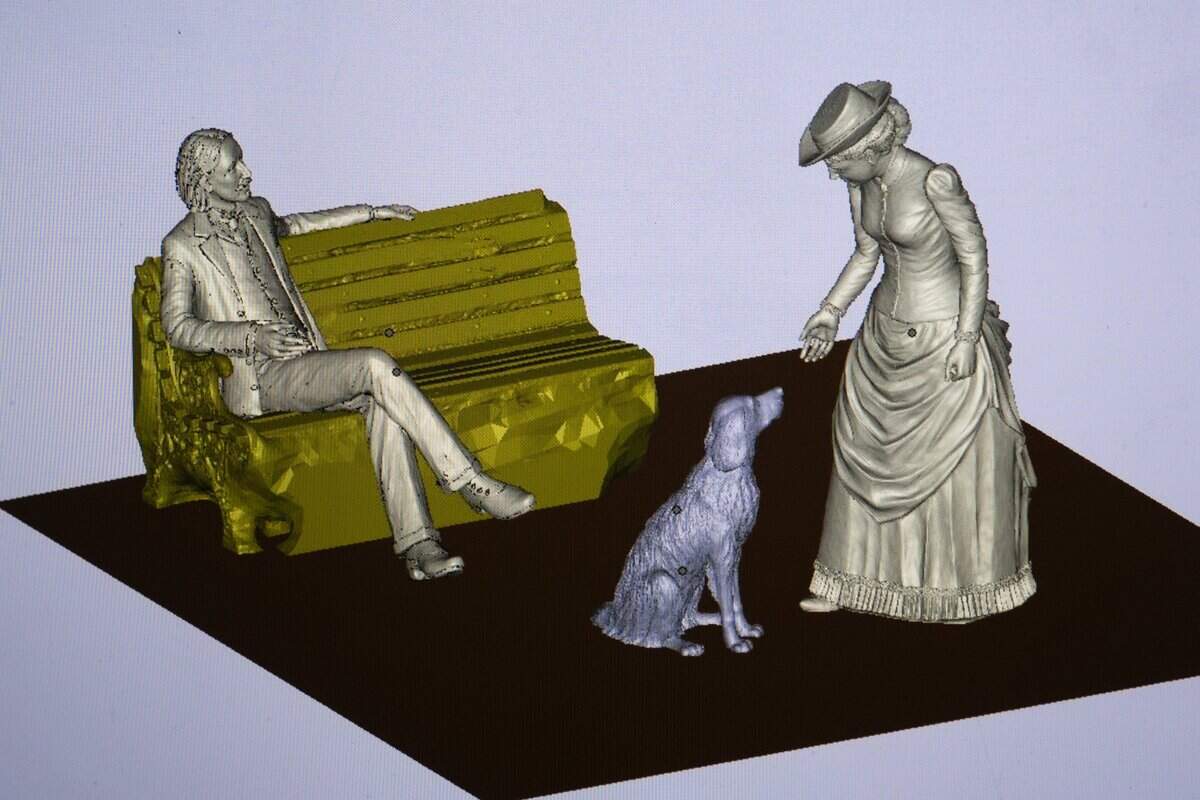 A model of a life-size bronze statue of Robert Louis Stevenson, his wife, Fanny Osbourne Stevenson, and their dog, Chuchu, is displayed on a computer screen in sculptor Garr Ugalde’s Sacramento studio.