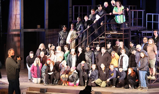 Ron "R.R." Jones, far left, working to take a cast photo of "King Lear" when it was presented by Santa Cruz Shakespeare in 2023. Jones was often seen wearing a mask once issues with his health were diagnosed. (Shmuel Thaler Santa Cruz Sentinel file)