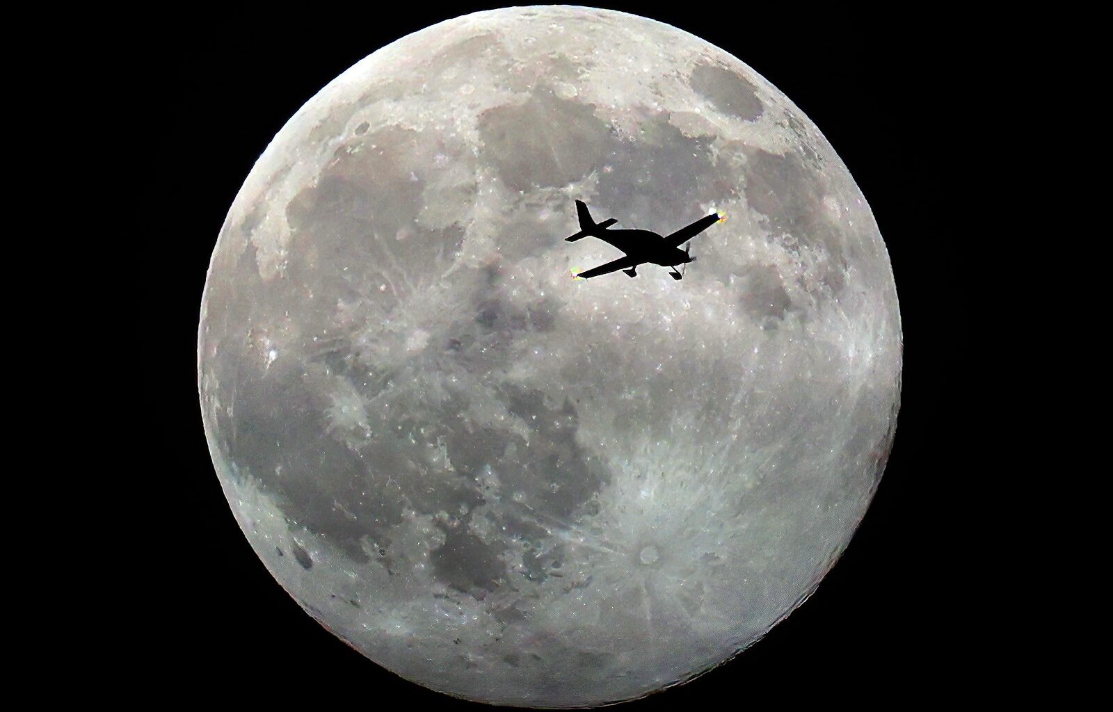 Plane flies in front of full moon above Santa Cruz – Santa Cruz Sentinel