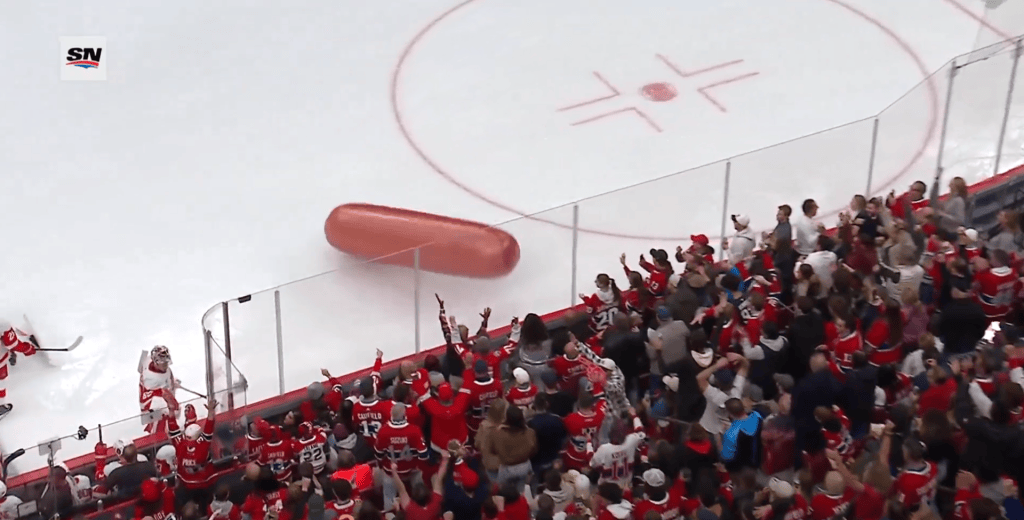 An inflatable hot dog lands on the ice at Bell Centre on Saturday night during a game between the Canadiens and the Red Wings. 