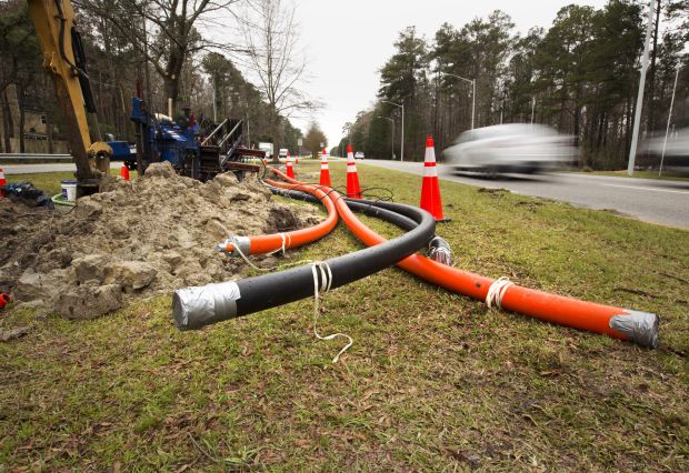 File photo of cables being placed underground along General Booth Boulevard near South Birdneck Road, 2017, part of the transoceanic fiber cable connections that come ashore in Virginia Beach, Virginia. (Staff/File)