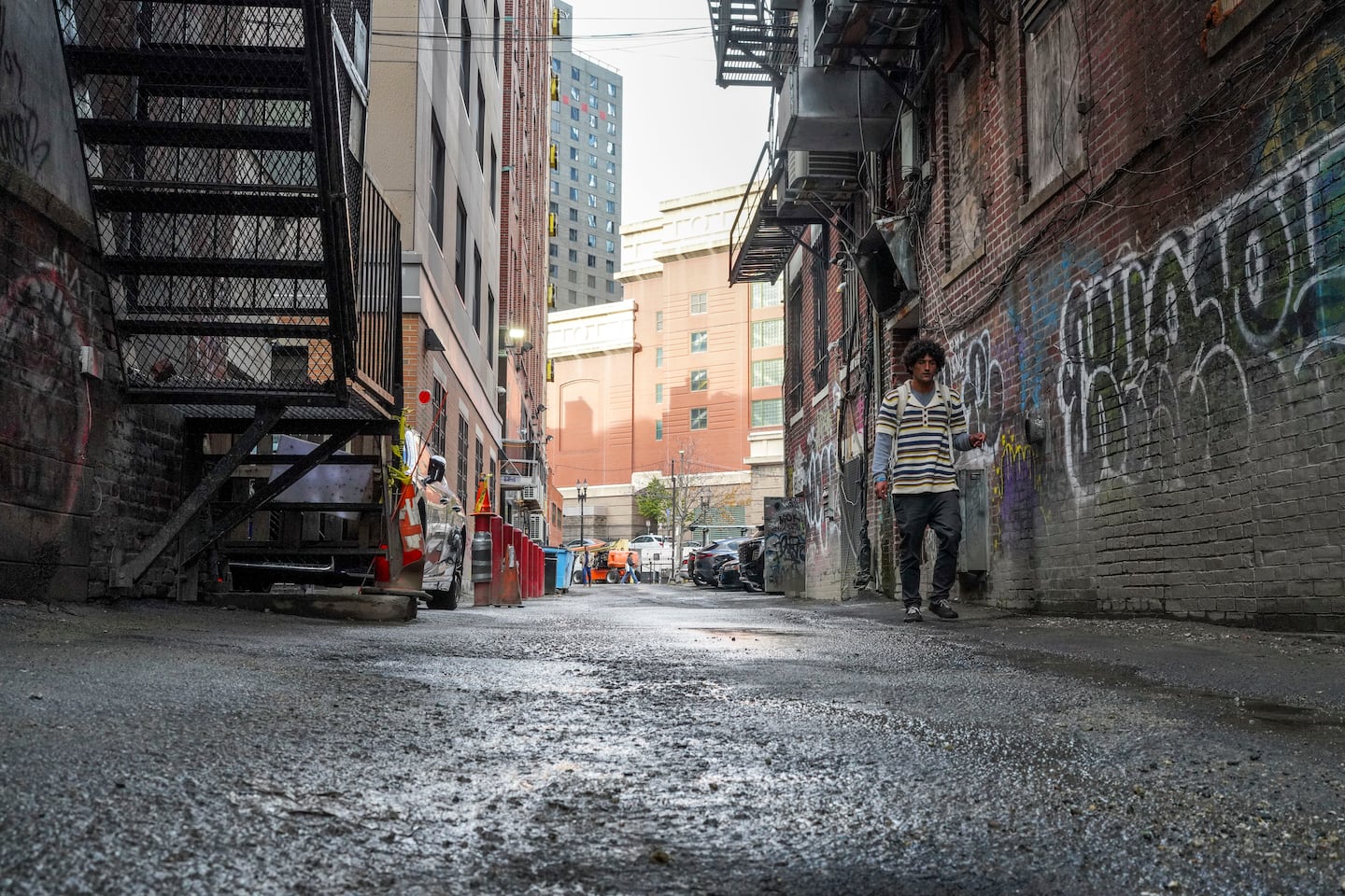 On Wednesday, a person walked past where a permanent puddle used to cause trouble.