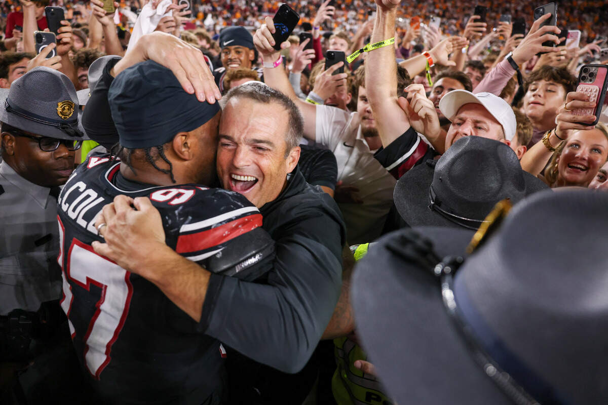 South Carolina head coach Shane Beamer celebrates with linebacker Kelby Collins (97) following the Gamecocks’ win over Tennessee in Columbia on Saturday, October 24, 2026.