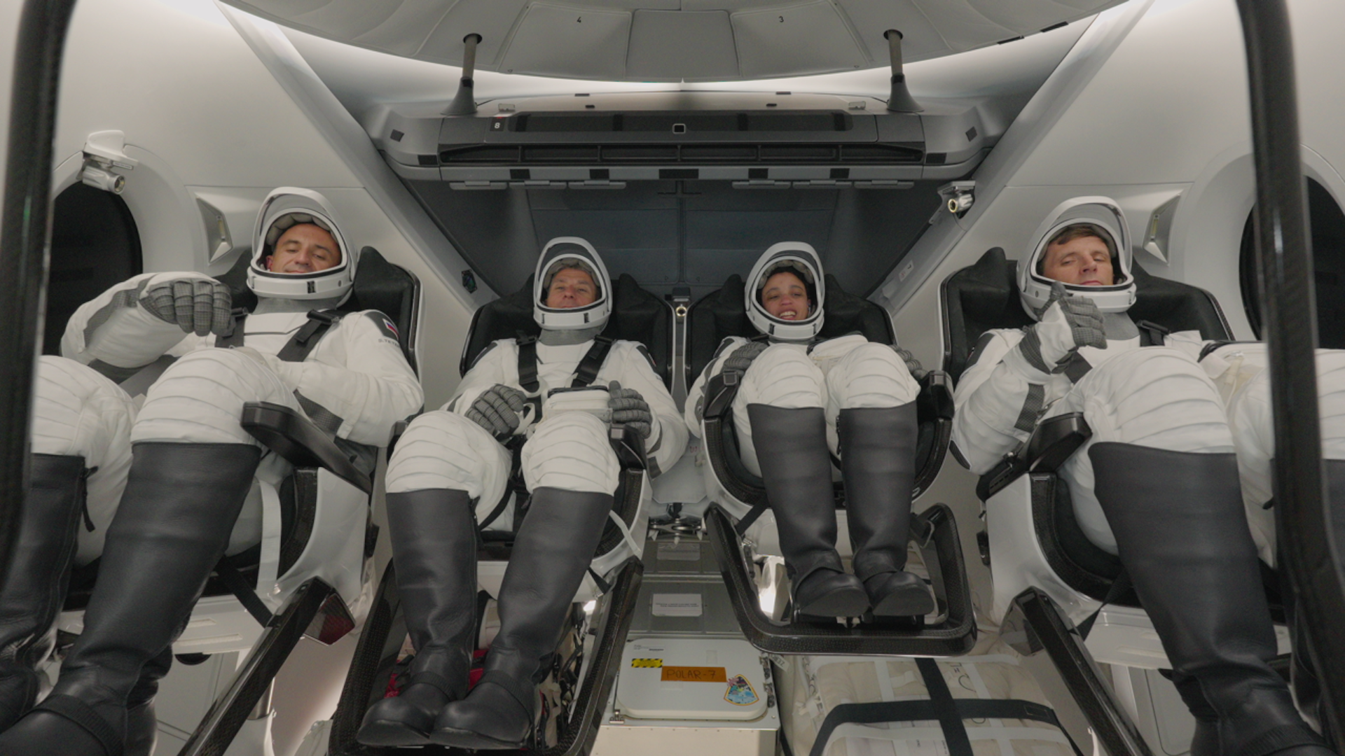 Four SpaceX Crew-13 astronauts inside their Dragon spacecraft