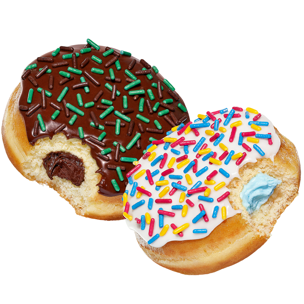 Two donuts, one with chocolate frosting and green sprinkles, the other with white icing and colorful sprinkles, both partially bitten. Two donuts, one with chocolate frosting and green sprinkles, the other with white icing and colorful sprinkles, both partially bitten.