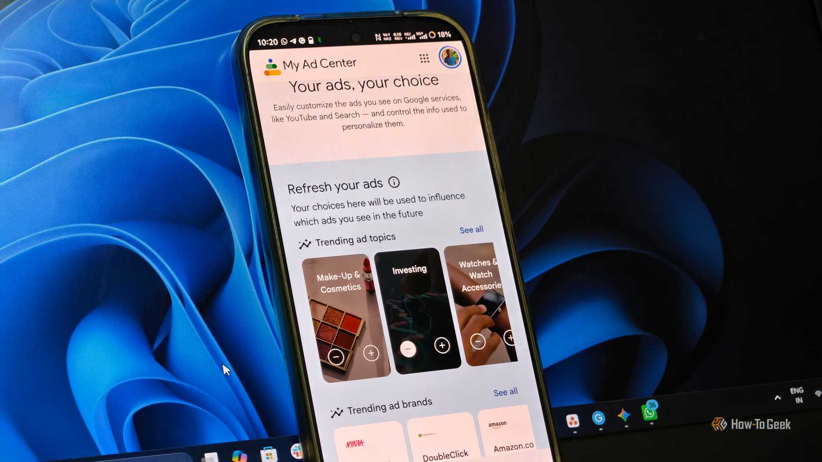 Android phone displaying Google My Ad Center with controls for personalized ad topics and brands.