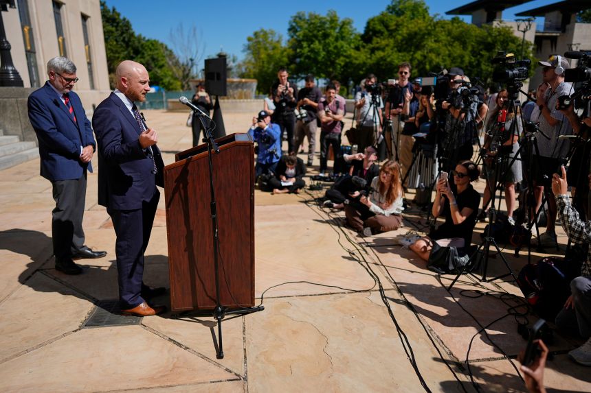 Christa Pike's attorneys – Luke Ihnen, center, and Randy Spivey – hold a news conference after a court hearing Wednesday in Nashville.