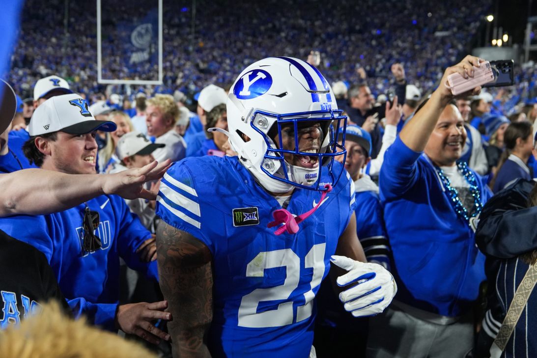 BYU Cougars fans storm the field after defeating Notre Dame during a massive primetime game last week. The win helped the Cougars move up to No. 2 in the nation.