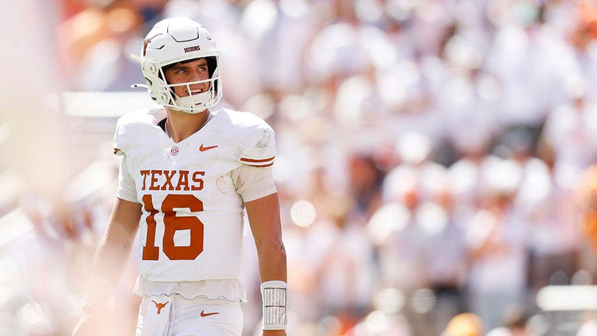 Arch Manning #16 of the Texas Longhorns looks on during a game at Neyland Stadium.