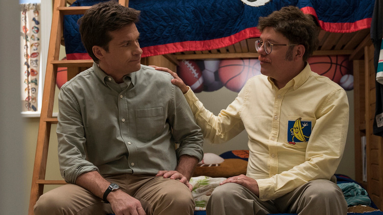 Jason Bateman as Michael sitting on a bed next to David Cross as Tobias in Arrested Development