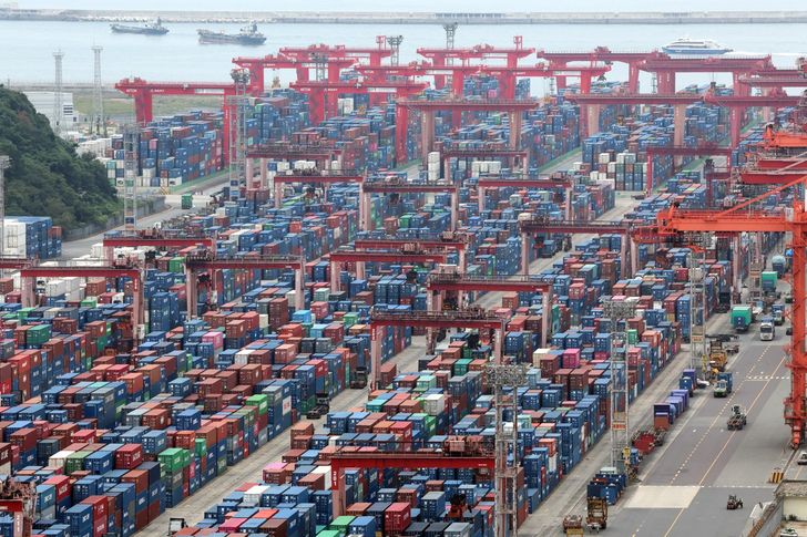 Containers bound for export are stacked at a port in Busan, Oct. 1. Yonhap 