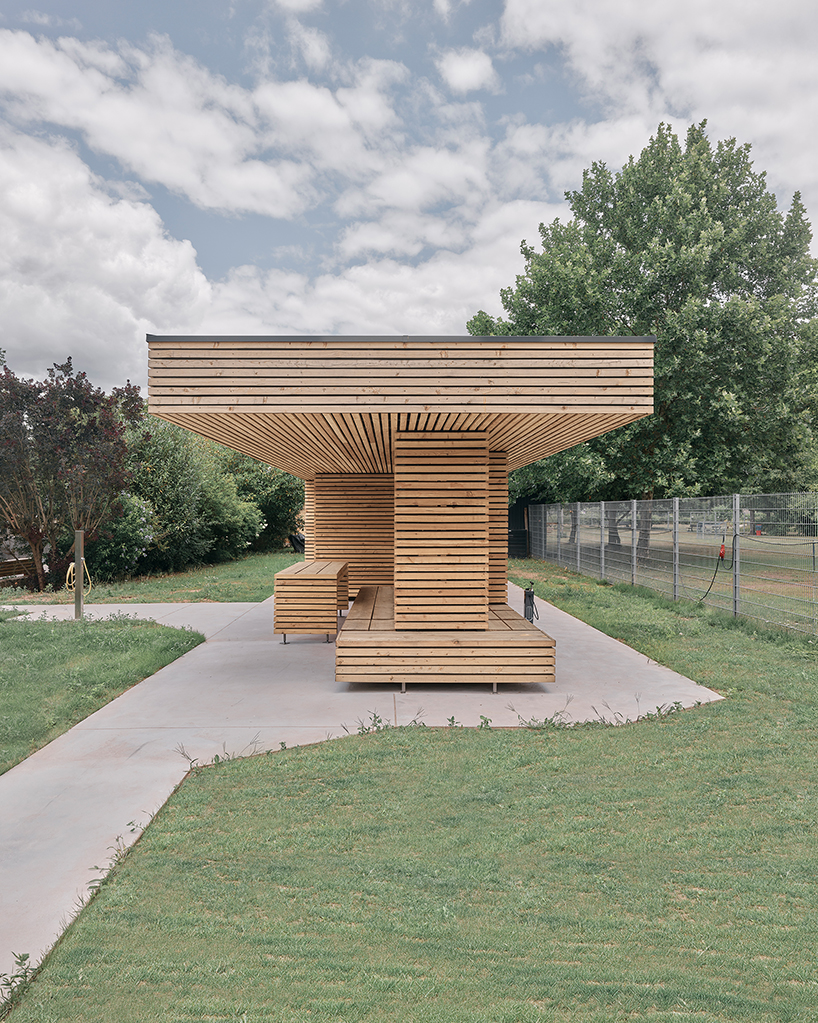 tob.studio’s timber bike station in germany resembles stacked log pile - 3