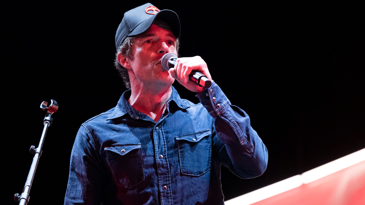 Brandon Flowers sings in concert