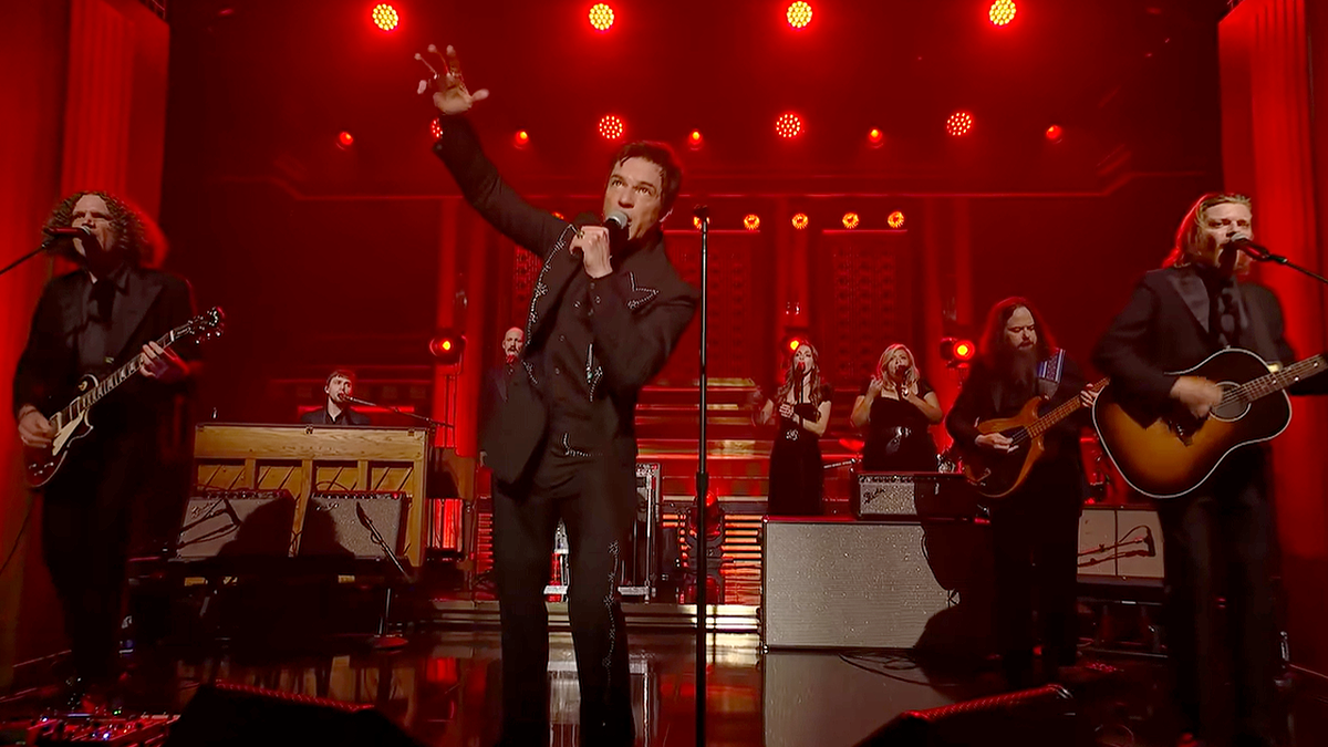 Brandon Flowers performs on stage