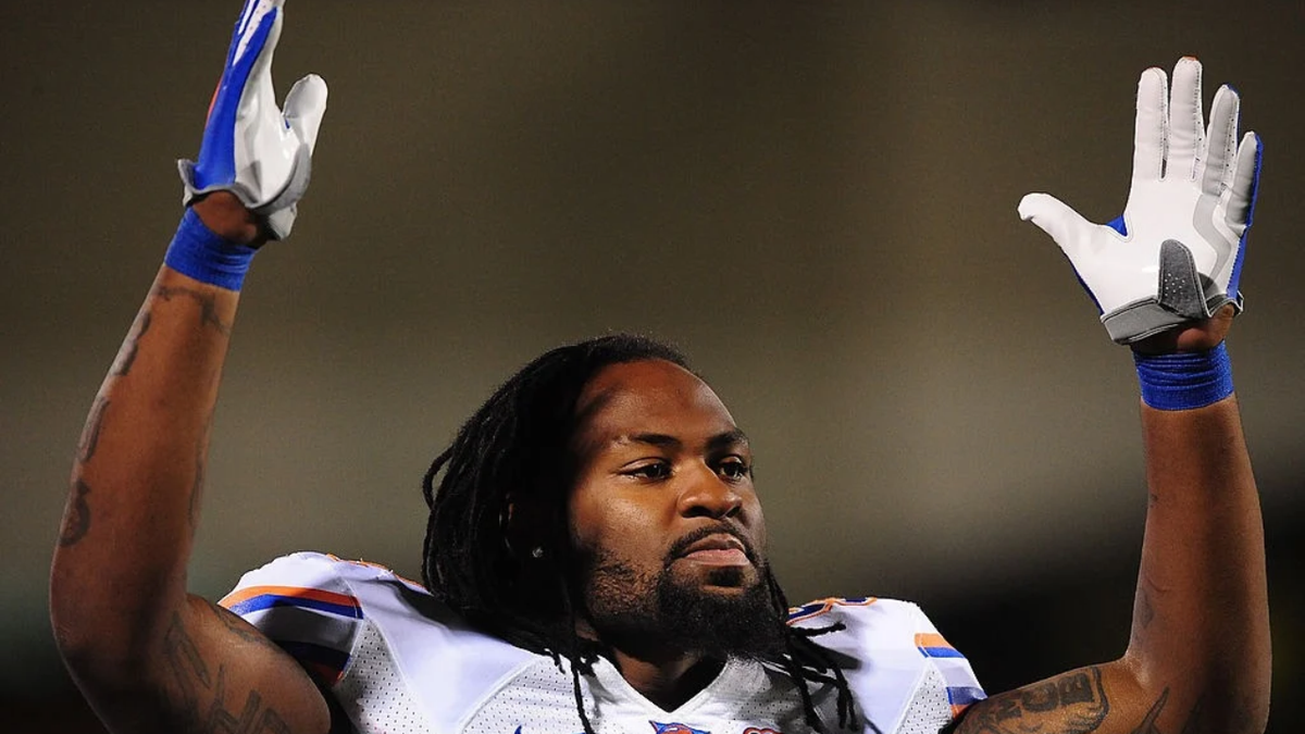Brandon Spikes signals a touchdown at Davis Wade Stadium.