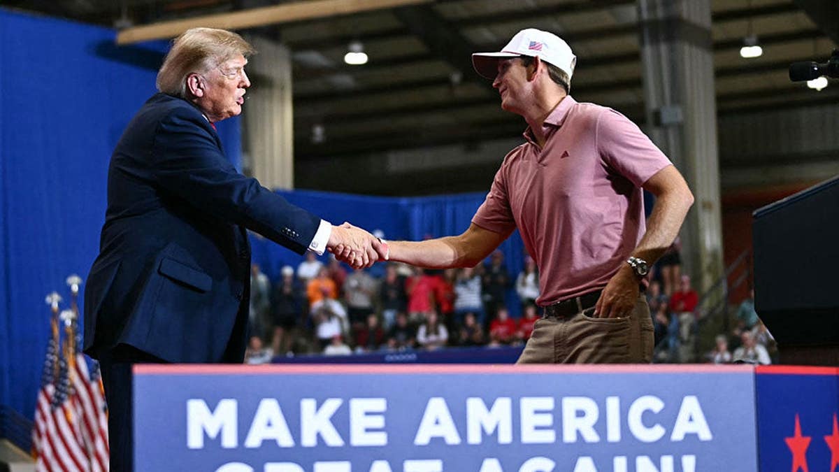 Jacob Bridgeman shakes hands with US President Donald Trump