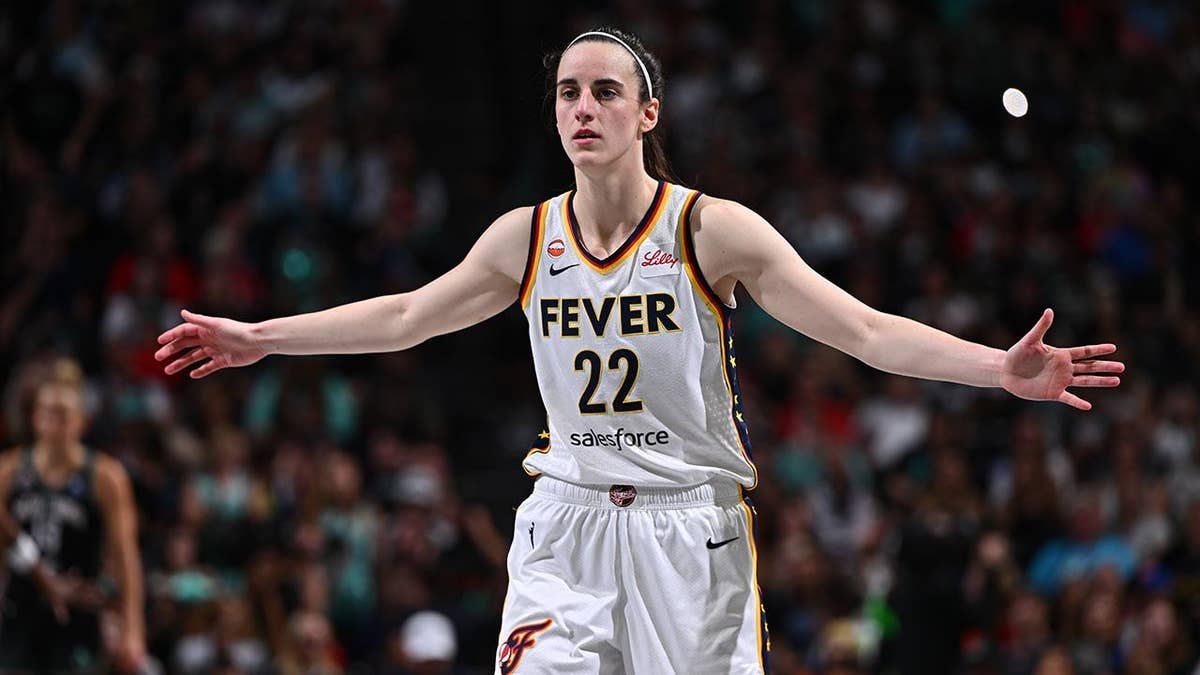 Caitlin Clark looks on during a WNBA game
