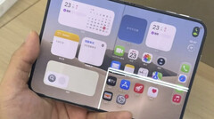 iPhone Duo unfolded with a bright horizontal line across its inner display.