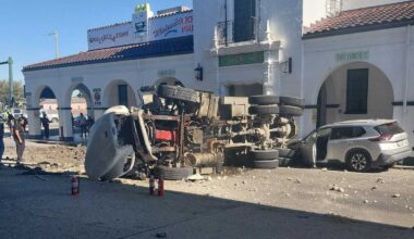 Two people hospitalized after truck crashes through barricade