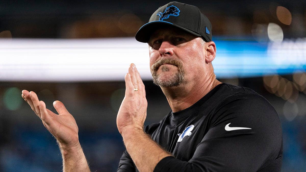 Dan Campbell looks on the sideline before an NFL game in Charlotte, North Carolina.