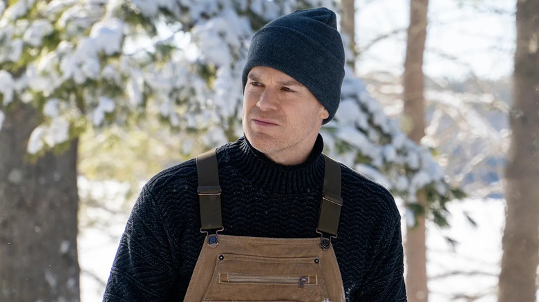 Michael C. Hall as Dexter wearing overalls in the snow in Dexter New Blood