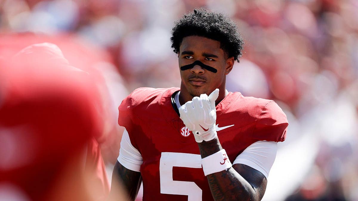 Dijon Lee Jr., defensive back No. 5, takes the field before a game at Bryant Denny Stadium.