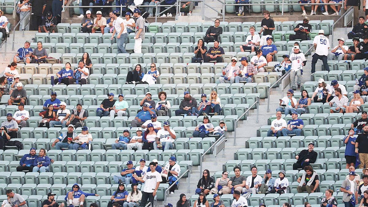 Fans watch from the stands inside Dodger Stadium during a National League Championship Series game.