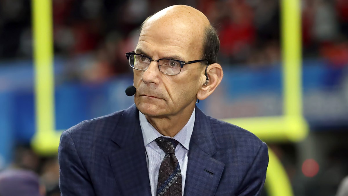Paul Finebaum looks on