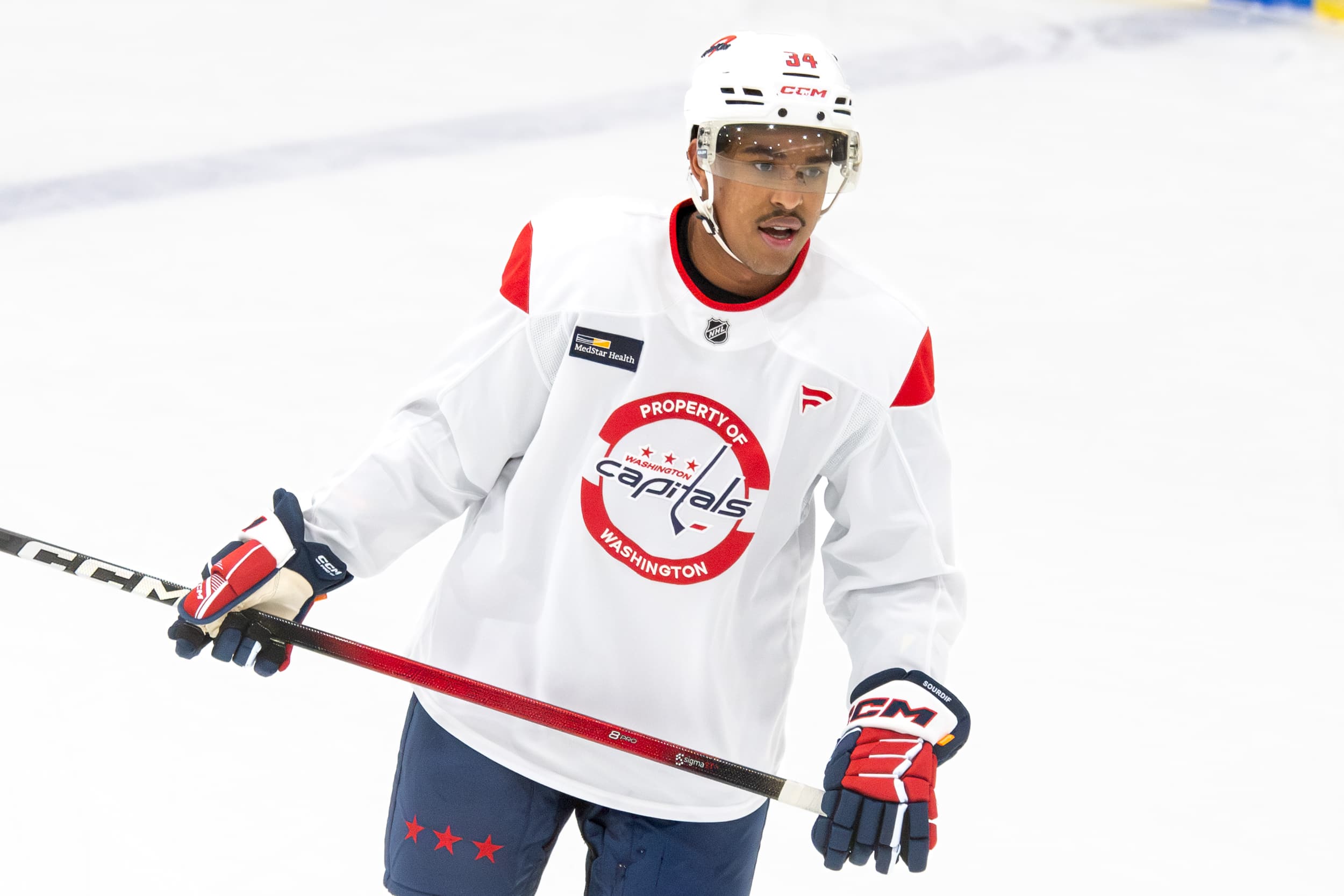 Justin Sourdif on the ice in a Capitals practice uniform