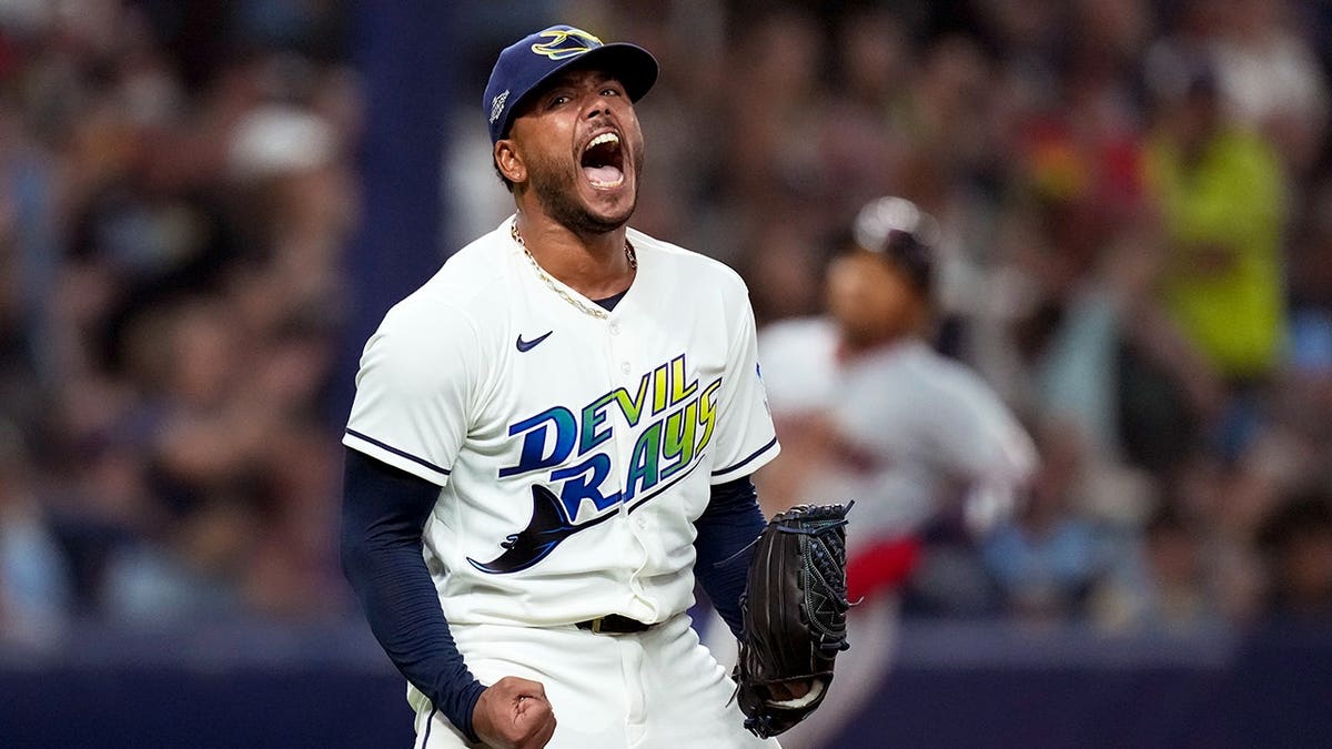 Freddy Peralta celebrates after the last out in the fifth inning.