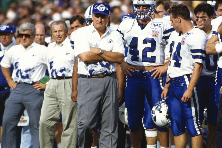 LaVell Edwards walks along the sideline during a game in 1994.