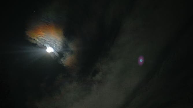 CHARLOTTE, UNITED STATES - JANUARY 13: The first full moon of the 2025 called 'Wolf Moon' that seen next to Mars rises over the sky during a lunar occultation of Mars in Charlotte, United States on January 13, 2025.