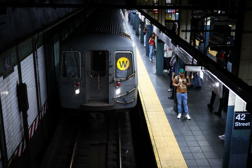 Commuters wait for the subway train to arrive at a station in Manhattan, New York, on July 7, 2026.
