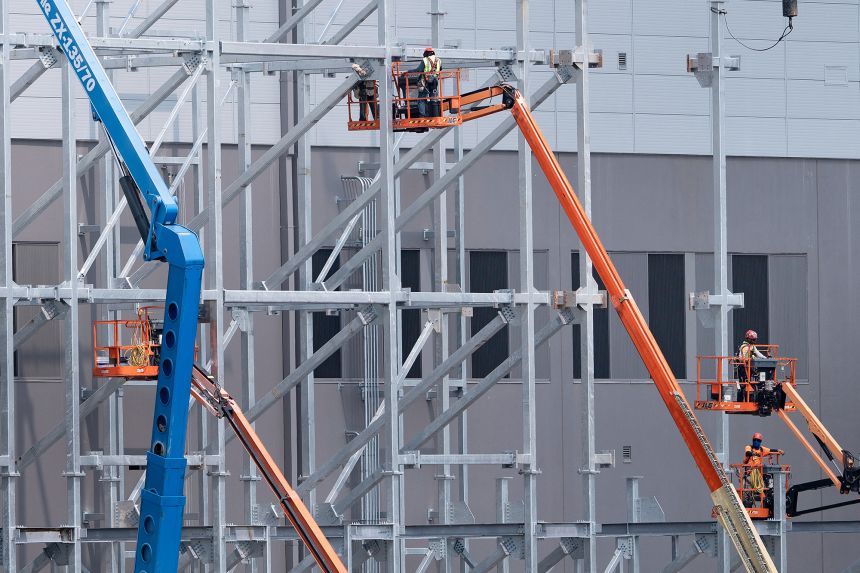 Construction workers build a new data center in Stone Ridge, Virginia on August 12, 2026.