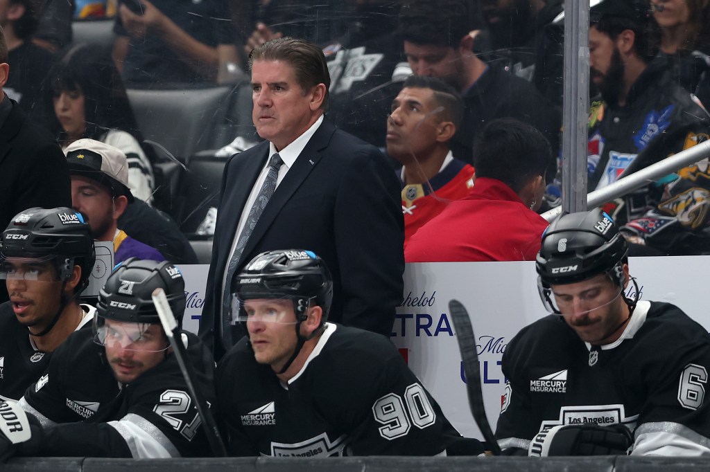 Head coach Peter Laviolette of the Los Angeles Kings looks on from the bench during a game against the Florida Panthers.
