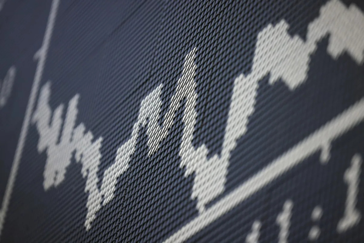 Stocks sink as traders brace for tech earnings, central bank decisions
