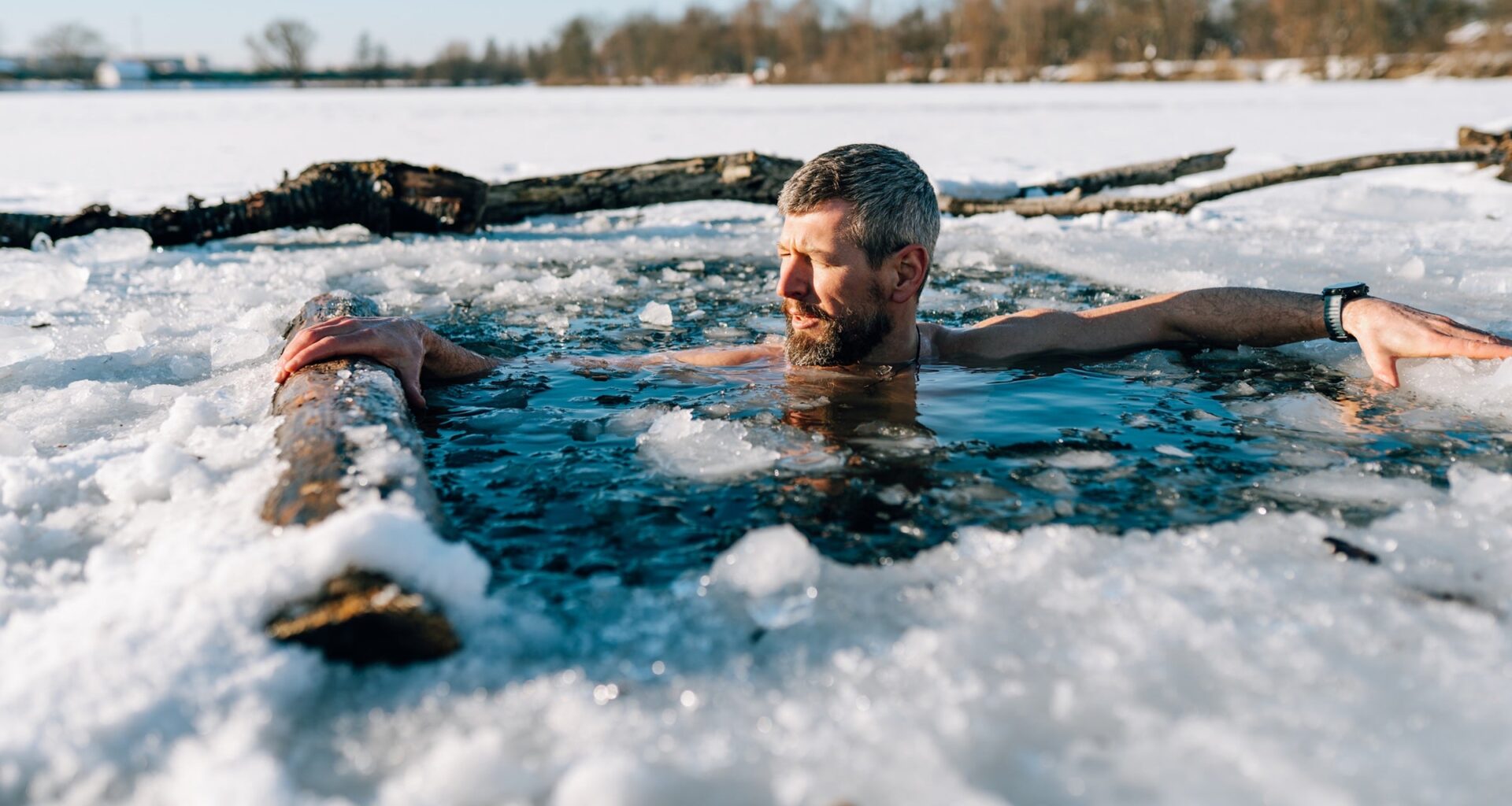 man in frozen, icy lake
