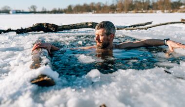 man in frozen, icy lake