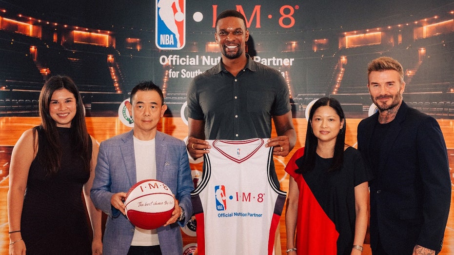Two-time NBA champion Chris Bosh, legendary soccer star David Beckham and NBA executives pose for IM8 and NBA partnership.
